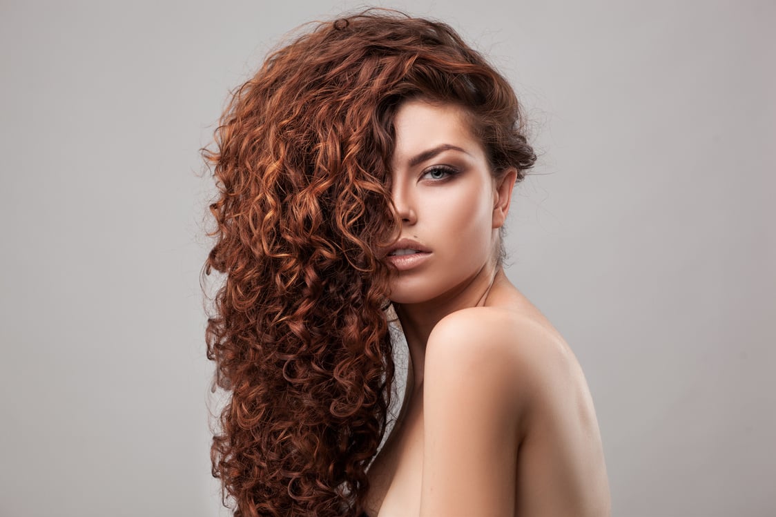 woman with healthy brown curly hair